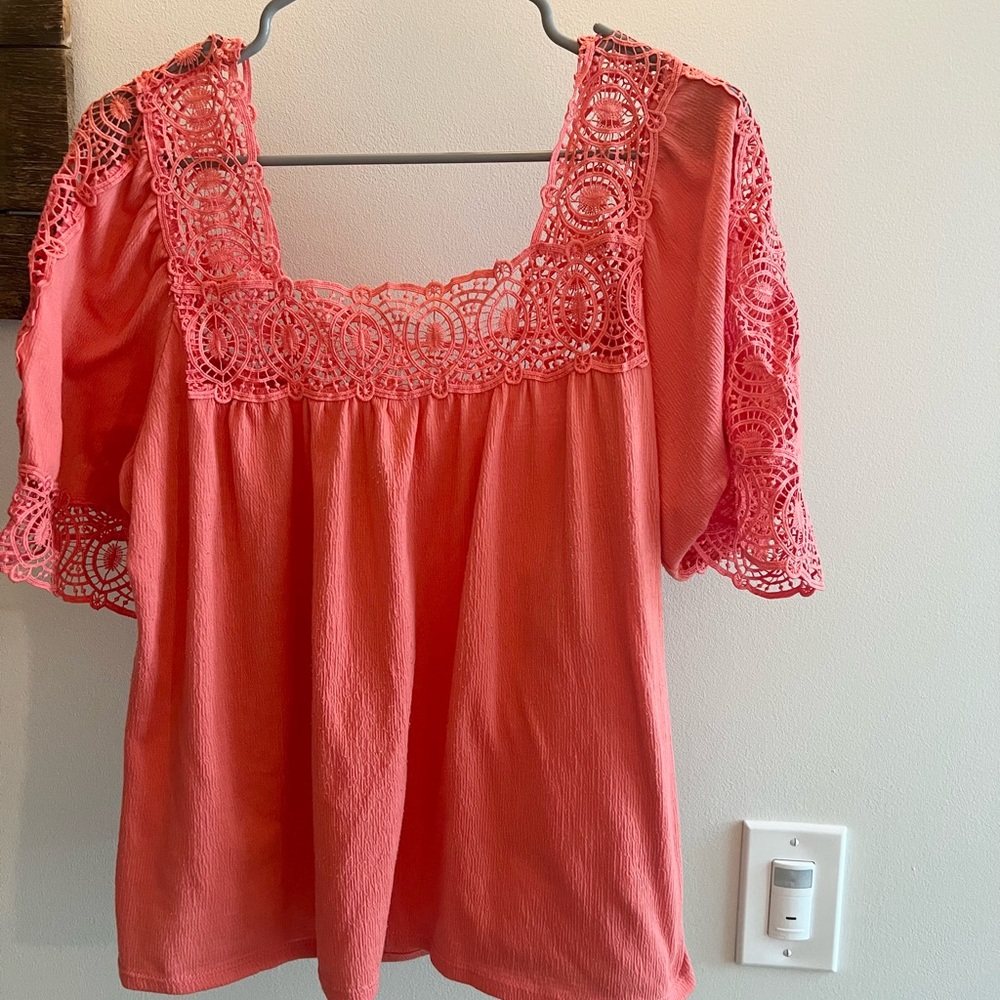 Beautiful oranges red top designs on the sleeves